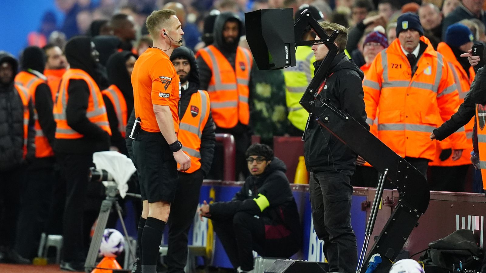 Craig Pawson checks VAR