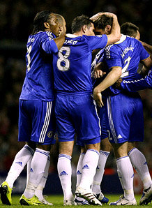 Chelsea players celebrate with Branislav Ivanovic